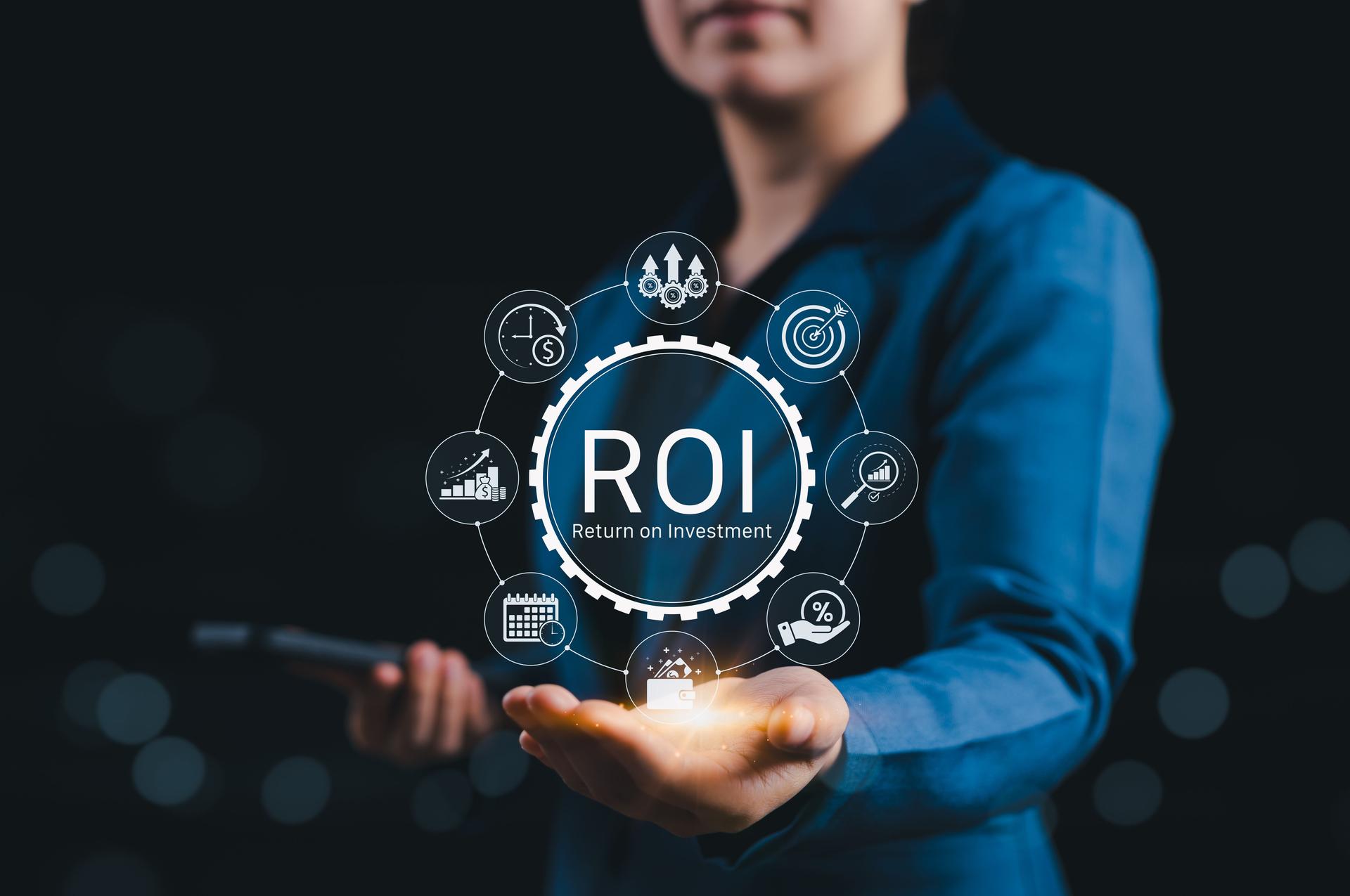 Analyzing ROI and Business Strategy Concepts. Businessperson holding digital icon representing ROI, financial strategies, return on investment, and efficiency. calculate profit, marketing plan, profit